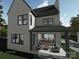 Backyard patio with outdoor seating area. Modern home with a gray patio at 19110 Newburg Hill Rd, Davidson, NC 28036