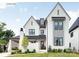 Stunning two-story home with a manicured lawn, elegant white brick, and refined modern design at 19110 Newburg Hill Rd, Davidson, NC 28036
