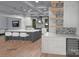 Stylish kitchen featuring an island with seating, custom backsplash, and modern appliances at 19110 Newburg Hill Rd, Davidson, NC 28036