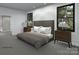 Comfortable main bedroom with neutral tones, bedside tables, and natural lighting at 19110 Newburg Hill Rd, Davidson, NC 28036