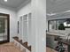 Welcoming mudroom with built-in shelving, a bench, and a view into the living room at 19110 Newburg Hill Rd, Davidson, NC 28036