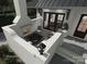 Cozy outdoor patio with a brick fireplace, comfortable seating, and stylish decor at 19110 Newburg Hill Rd, Davidson, NC 28036