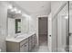 Well-lit primary bathroom with double sink vanity and a glass enclosed shower at 200 Lake George Dr, Shelby, NC 28152