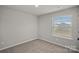 Well-lit bedroom features plush carpet, and a bright sunny window, a peaceful retreat at 200 Lake George Dr, Shelby, NC 28152