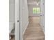 Hallway with durable light wood flooring flowing into a living space with natural light at 200 Lake George Dr, Shelby, NC 28152