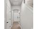 Bright hallway featuring archway, neutral paint, and durable light wood flooring at 200 Lake George Dr, Shelby, NC 28152