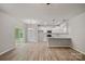 Open-concept living room with access to the backyard and a modern kitchen at 200 Lake George Dr, Shelby, NC 28152