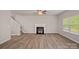 Bright living room features fireplace, and hardwood floors, perfect for gathering and making memories at 200 Lake George Dr, Shelby, NC 28152