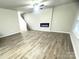 Bright living room features modern fireplace and hardwood floors, perfect for entertaining guests at 200 Lake George Dr, Shelby, NC 28152