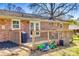 Backyard with a raised deck, grill, storage container and riding toys at 2027 Franklin St, Rock Hill, SC 29732