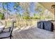 Outdoor deck with a grill, table and chairs overlooking a lush backyard at 2027 Franklin St, Rock Hill, SC 29732