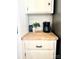 Kitchen counter with light wood butcher block, white cabinets, coffee maker, and coffee at 2027 Franklin St, Rock Hill, SC 29732