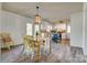 Open dining area with wooden table and chairs, connected to a bright kitchen at 2027 Franklin St, Rock Hill, SC 29732