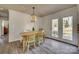 Dining room features wood table, chairs, decorative light fixture, and patio door at 2027 Franklin St, Rock Hill, SC 29732