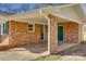 Brick home featuring an outdoor car port and two green doors at 2027 Franklin St, Rock Hill, SC 29732
