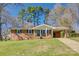 Charming single story home with a brick facade, green shutters, and a well-maintained front lawn at 2027 Franklin St, Rock Hill, SC 29732