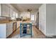 Open kitchen with island, stainless steel appliances, and ample storage space at 2027 Franklin St, Rock Hill, SC 29732