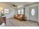 Bright living room featuring wood floors, a leather couch, and neutral-colored walls at 2027 Franklin St, Rock Hill, SC 29732
