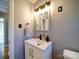 Stylish bathroom featuring modern vanity, updated fixtures, and neutral color palette at 2036 Edgewater Dr, Charlotte, NC 28210