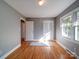 Bedroom showcasing wood floors, neutral walls, and natural lighting at 2036 Edgewater Dr, Charlotte, NC 28210