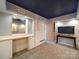 Unique bedroom with starry night ceiling, built-in cabinets, and cozy carpeting at 2036 Edgewater Dr, Charlotte, NC 28210