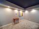 Carpeted bedroom with dark star ceiling and neutral wall colors at 2036 Edgewater Dr, Charlotte, NC 28210