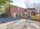 Brick home featuring a back patio, deck, fenced in area and exterior access at 2036 Edgewater Dr, Charlotte, NC 28210