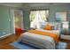 Bright bedroom with modern decor, hardwood floors, and adjacent bathroom at 2207 Windsor Woods Dr, Gastonia, NC 28054