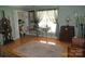 Spacious bedroom with hardwood floors, natural light, and adjacent bathroom at 2207 Windsor Woods Dr, Gastonia, NC 28054