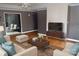 Cozy living room with modern furniture, warm lighting, and hardwood flooring, perfect for relaxation at 2207 Windsor Woods Dr, Gastonia, NC 28054