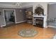 Open living room with fireplace, hardwood floors, and elegant decorative touches at 2207 Windsor Woods Dr, Gastonia, NC 28054