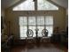Well-lit living room with high ceilings, charming decor, and large windows at 2207 Windsor Woods Dr, Gastonia, NC 28054