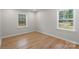 Bright bedroom with hardwood flooring and natural light from large windows at 2509 Wesley Chapel Rd, Indian Trail, NC 28079