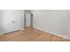 Bright bedroom featuring hardwood floors and white double door closet at 2509 Wesley Chapel Rd, Indian Trail, NC 28079