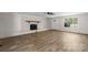 Bright living room features a fireplace, doorway, and window at 2509 Wesley Chapel Rd, Indian Trail, NC 28079