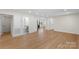 Bright and spacious living area with light-colored walls, hardwood flooring, and a modern bathroom at 2509 Wesley Chapel Rd, Indian Trail, NC 28079