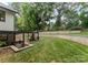 This expansive backyard boasts tiered retaining walls, enhancing the outdoor living experience at 3416 Windsor Dr, Charlotte, NC 28209