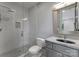 Elegant bathroom featuring a glass-enclosed shower, marble countertop, and modern fixtures at 3416 Windsor Dr, Charlotte, NC 28209