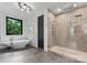 Modern bathroom with a freestanding tub and walk-in shower at 3416 Windsor Dr, Charlotte, NC 28209
