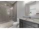 Contemporary bathroom featuring a glass-enclosed shower, toilet, and stylish vanity with a sleek countertop at 3416 Windsor Dr, Charlotte, NC 28209