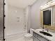 Modern bathroom featuring a tub/shower combination, designer tile, and sleek vanity with ample counter space and storage at 3416 Windsor Dr, Charlotte, NC 28209