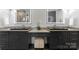 Elegant bathroom featuring dual vanities and dark cabinetry at 3416 Windsor Dr, Charlotte, NC 28209