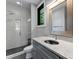 Elegant bathroom featuring a glass-enclosed shower, sleek vanity, and modern fixtures for a spa-like experience at 3416 Windsor Dr, Charlotte, NC 28209