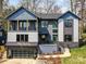 Stunning modern home with a balcony, brick accents, and a convenient two-car garage at 3416 Windsor Dr, Charlotte, NC 28209