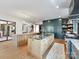 Modern kitchen featuring a large island with seating, and a full suite of appliances at 3416 Windsor Dr, Charlotte, NC 28209