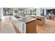 Bright kitchen boasts granite countertops, custom cabinets, stainless appliances, and wood floors at 3416 Windsor Dr, Charlotte, NC 28209