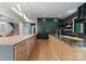 Spacious kitchen featuring wood floors, an island, and state-of-the-art appliances at 3416 Windsor Dr, Charlotte, NC 28209