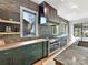 Close up of kitchen featuring a gas cooktop, modern appliances, and open shelving at 3416 Windsor Dr, Charlotte, NC 28209