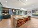 Spacious kitchen featuring an island with seating, modern appliances, and custom cabinetry at 3416 Windsor Dr, Charlotte, NC 28209