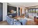 Comfortable living room features a wet bar, modern furnishings and decor, and wood floors at 3416 Windsor Dr, Charlotte, NC 28209